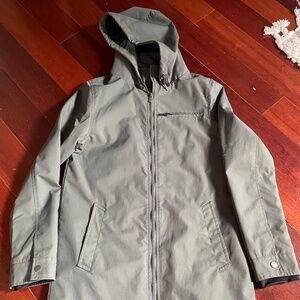 Roamer’s grey raincoat